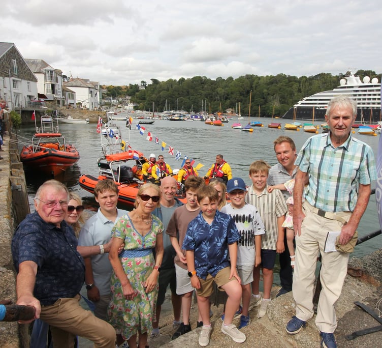 Donor Alan Jackson (left) joined by friends and family celebrate the arrival of Spirit of Daisy, Fowey’s new Atlantic 85 inshore lifeboat