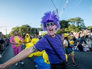 Buoyant crowd gathers to enjoy colourful parade