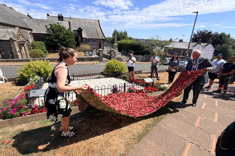 Krystal Read and Saltash Mayor, Cllr Brian Stoyel, officially unveil the restored Pebble Memorial