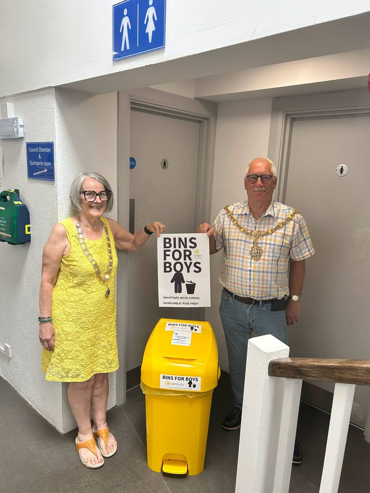 Liskeard deputy mayor, Cllr Sylvia Berry alongside mayor, Cllr David Braithwaite, help launch the Bins for Boys initiative in the Public Hall
