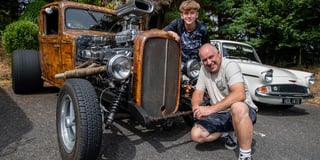 Classic cars on show while rock and roll plays