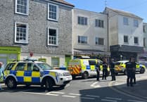 Armed police in city centre as three injured