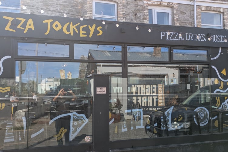 A man smashed the front door window of Pizza Jockeys before removing the safe (Picture: Warren Wilkins)