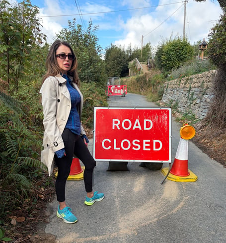 Cllr Julie Cunningham pictured at the road closure, which has been in place for almost nine months.