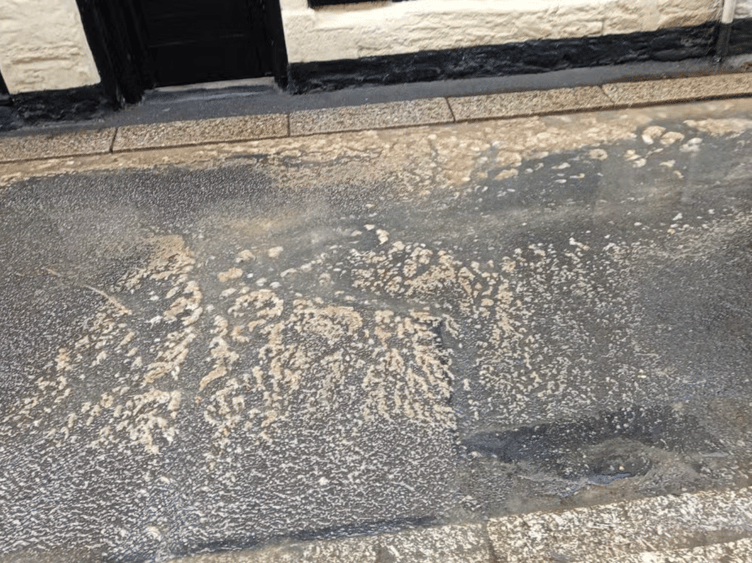Sewage was seen running through Fowey's Fore Street over the Bank Holiday weekend