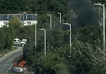 Motorists urged to avoid village after car fire