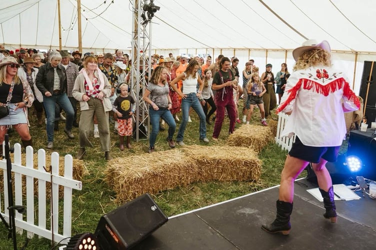 Line dancing at the Cyder Barn was popular among festivalgoers