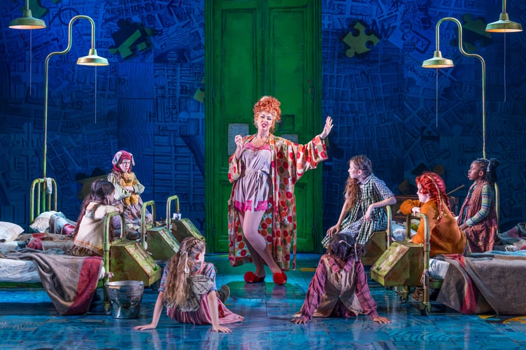  Claire Sweeney (Miss Hannigan) and young company (Picture: Paul Coltas)