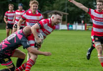 Saints hold on to start league season with victory
