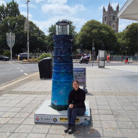 Diane Griffiths with her Celestial Beacon sculpture at Plymouth St Andrews Cross