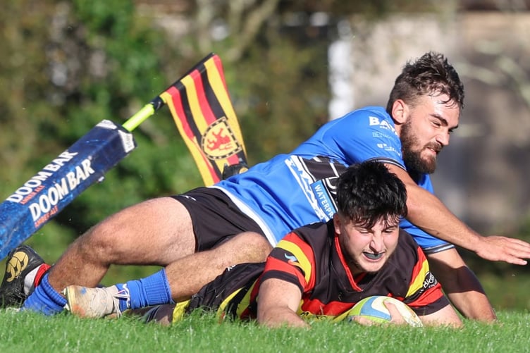 Centre Andrew Walsh dots down one of his two tries for the afternoon.