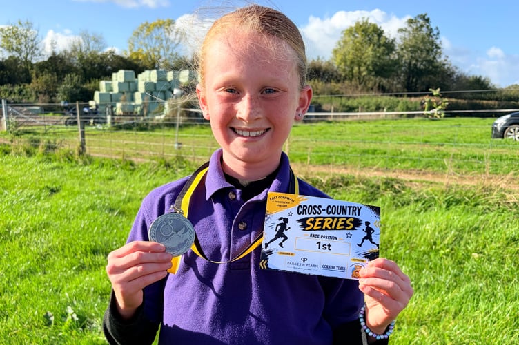 All smiles for this Bishop Cornish runner who took first place in the Year 3/4 Girls race